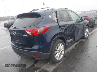 2014 Mazda CX-5 Grand Touring with VIN JM3KE4DY8E0366644, listed as a IAAI auction lot 41971438 with 135,644 mi miles and . Bid and sale history available at carsss.com. Image 4.