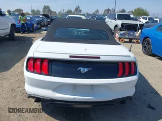 2020 Ford Mustang EcoBoost z VIN 1FATP8UH0L5105965, wystawiony jako IAAI lot #42475841 z przebiegiem 68 999 mil mil oraz . Historia ofert i sprzedaży dostępna na DreamBid. Obrazek 17.