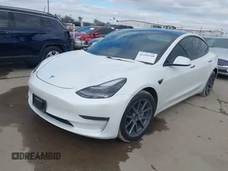 2021 Tesla Model 3 Long Range with VIN 5YJ3E1EB9MF059554, listed as a IAAI auction lot 41231520 with 63,696 mi miles and . Bid and sale history available at DreamBid. Image 2.