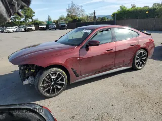 2022 BMW i4 eDrive40 with VIN WBY73AW05NFN05084, listed as a Copart auction lot 50677374 with 30,609 mi miles. Bid and sale history available at carsss.com. Image 1.