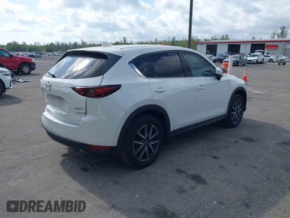 2018 Mazda CX-5 Grand Touring with VIN JM3KFBDM6J0451605, listed as a IAAI auction lot 42099182 with 81,703 mi miles and . Bid and sale history available at DreamBid. Image 4.