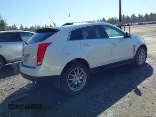 2014 Cadillac SRX Performance Collection with VIN 3GYFNFE30ES586713, listed as a IAAI auction lot 41791356 with 74,927 mi miles and . Bid and sale history available at DreamBid. Image 4.