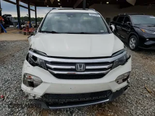 2017 Honda Pilot Touring z VIN 5FNYF6H92HB067140, wystawiony jako Copart lot #55757925 z przebiegiem 132 425 mil mil oraz Szkoda całkowita • Salvage title. Historia ofert i sprzedaży dostępna na DreamBid. Obrazek 5.
