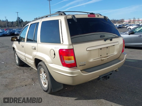 1999 Jeep Grand Cherokee Limited with VIN 1J4GW68N3XC688112, listed as a IAAI auction lot 41640033 with 196,851 mi miles. Bid and sale history available at carsss.com. Image 3.