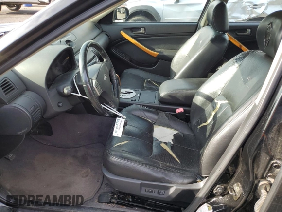 2004 Infiniti G35 w/Leather z VIN JNKCV51F34M708688, wystawiony jako Copart lot #59127945 z przebiegiem 199 727 mil mil oraz Szkoda całkowita • Salvage title. Historia ofert i sprzedaży dostępna na DreamBid. Obrazek 7.