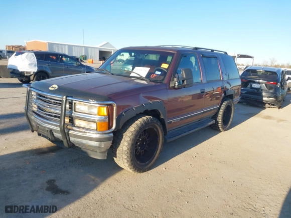 1996 Chevrolet Tahoe with VIN 1GNEK13R9TJ408499, listed as a IAAI auction lot 41308726 with 118,336 mi miles. Bid and sale history available at carsss.com. Image 2.