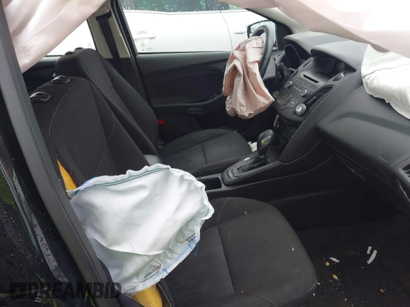 2017 Ford Focus SE z VIN 1FADP3F25HL253466, wystawiony jako IAAI lot #42303404 z przebiegiem 89 779 mil mil oraz . Historia ofert i sprzedaży dostępna na DreamBid. Obrazek 5.