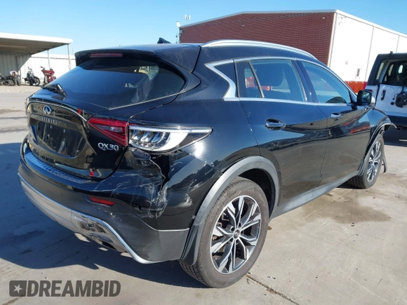 2018 Infiniti QX30 Luxury with VIN SJKCH5CRXJA058994, listed as a IAAI auction lot 41389481 with 69,907 mi miles and . Bid and sale history available at DreamBid. Image 4.