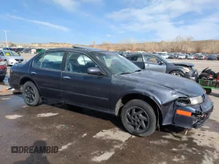 1997 Nissan Maxima GXE with VIN JN1CA21D0VT201140, listed as a Copart auction lot 52230495 with 286,440 mi miles and Clean title. Bid and sale history available at DreamBid. Image 4.