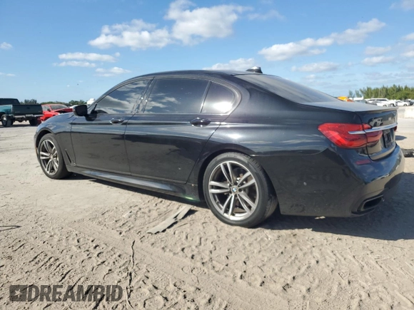 2017 BMW 7 Series 740i with VIN WBA7E2C51HG739462, listed as a Copart auction lot 84157364 with 137,881 mi miles and Salvage Title. Bid and sale history available at carsss.com. Image 2.