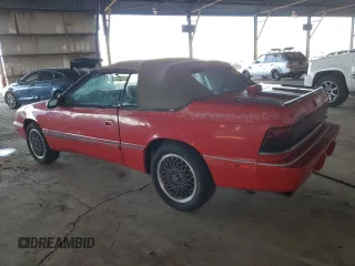 1990 Chrysler LeBaron z VIN 1C3XJ45J9LG405682, wystawiony jako Copart lot #48690985 z przebiegiem 75 714 mil mil oraz Tytuł czysty. Historia ofert i sprzedaży dostępna na DreamBid. Obrazek 2.