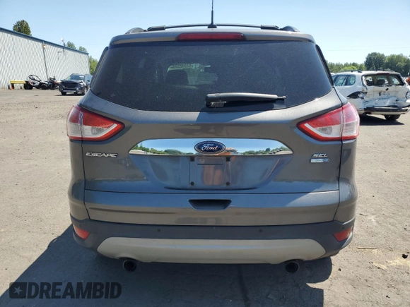 2013 Ford Escape SEL with VIN 1FMCU9HX1DUC79086, listed as a Copart auction lot 57312515 with 124,928 mi miles and Salvage title. Bid and sale history available at DreamBid. Image 6.
