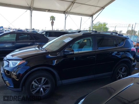 2018 Toyota RAV4 XLE with VIN 2T3WFREV2JW502622, listed as a IAAI auction lot 42327598 with 94,997 mi miles and . Bid and sale history available at DreamBid. Image 14.