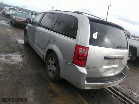 2010 Dodge Grand Caravan SXT with VIN 2D4RN5DX1AR127914, listed as a IAAI auction lot 41720511 with 169,953 mi miles. Bid and sale history available at carsss.com. Image 3.