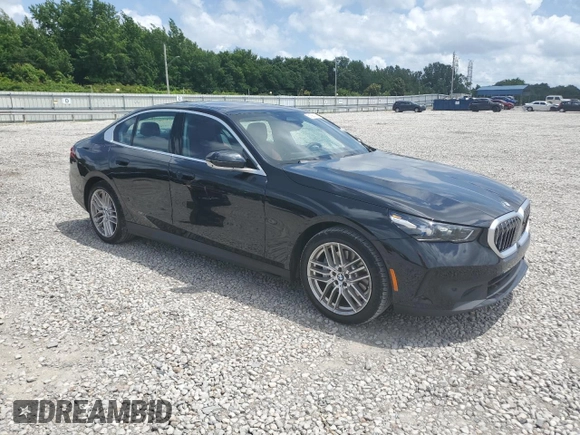 2024 BMW 5 Series 530i with VIN WBA43FJ09RCR05243, listed as a Copart auction lot 61690705 with 34,450 mi miles and Salvage title. Bid and sale history available at DreamBid. Image 4.