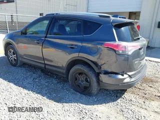 2016 Toyota RAV4 LE with VIN JTMZFREV5GJ078051, listed as a IAAI auction lot 41858381 with 97,032 mi miles and . Bid and sale history available at DreamBid. Image 3.