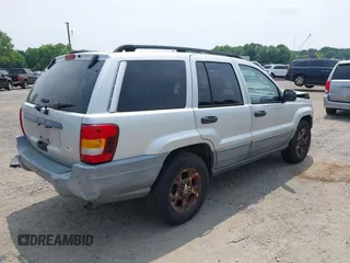 2002 Jeep Grand Cherokee Laredo with VIN 1J4GW48SX2C313093, listed as a IAAI auction lot 42446559 with 200,319 mi miles and . Bid and sale history available at DreamBid. Image 4.