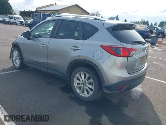 2014 Mazda CX-5 Grand Touring with VIN JM3KE4DY9E0375014, listed as a IAAI auction lot 42000382 with 110,584 mi miles and . Bid and sale history available at DreamBid. Image 3.