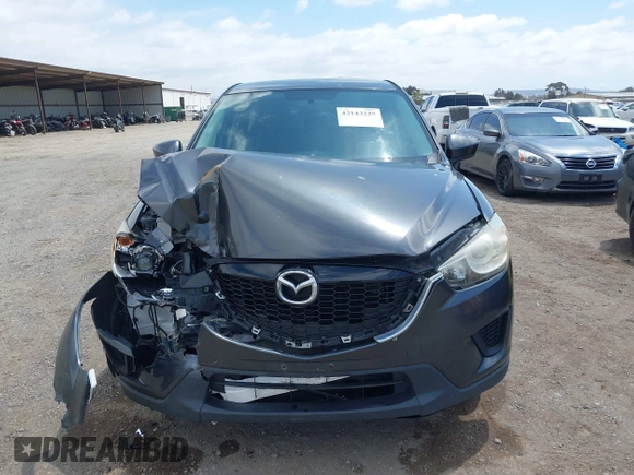 2014 Mazda CX-5 Sport with VIN JM3KE2BE0E0411377, listed as a IAAI auction lot 42143229 with 137,384 mi miles and . Bid and sale history available at carsss.com. Image 12.