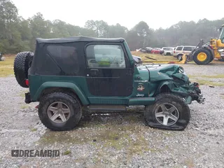 2000 Jeep Wrangler Sahara with VIN 1J4FA59SXYP701098, listed as a IAAI auction lot 41592872 with 1 mi miles. Bid and sale history available at carsss.com. Image 12.
