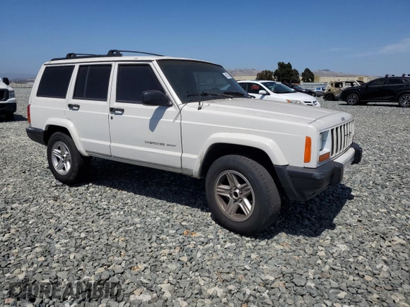 2000 Jeep Cherokee with VIN 1J4FT48S6YL152495, listed as a Copart auction lot 60627965 with 196,086 mi miles and Salvage title. Bid and sale history available at DreamBid. Image 4.