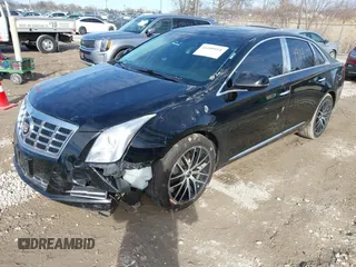 2015 Cadillac XTS Luxury z VIN 2G61N5S35F9155543, wystawiony jako IAAI lot #41699914 z przebiegiem 120 700 mil mil oraz . Historia ofert i sprzedaży dostępna na DreamBid. Obrazek 2.