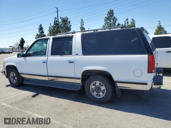 1999 Chevrolet Suburban with VIN 3GNEC16R0XG164600, listed as a Copart auction lot 49516445 with 105,747 mi miles and Salvage Title. Bid and sale history available at carsss.com. Image 2.