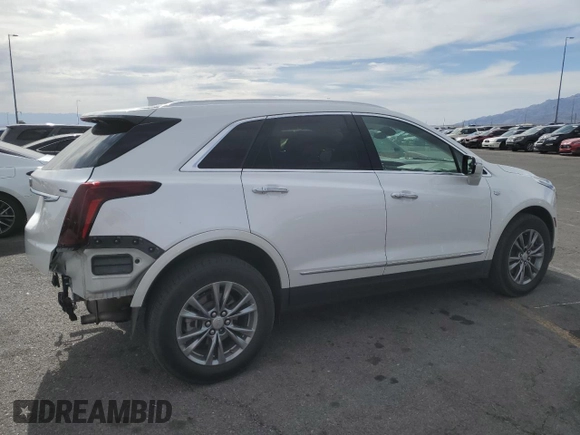 2021 Cadillac XT5 FWD Premium Luxury with VIN 1GYKNCRS0MZ110560, listed as a Copart auction lot 52779575 with 44,559 mi miles and Salvage title. Bid and sale history available at DreamBid. Image 3.