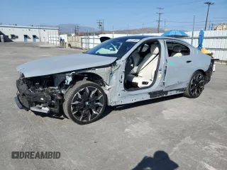 2024 BMW 5 Series 530i with VIN WBA43FJ06RCP67824, listed as a Copart auction lot 61351965 with 12,990 mi miles and Salvage title. Bid and sale history available at DreamBid. Image 1.