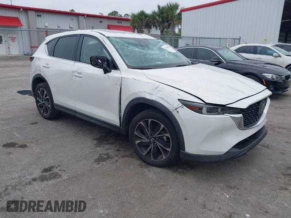 2023 Mazda CX-5 2.5 S Premium Package with VIN JM3KFBDM1P0126787, listed as a IAAI auction lot 41164586 with 12,076 mi miles. Bid and sale history available at carsss.com. Image 1.