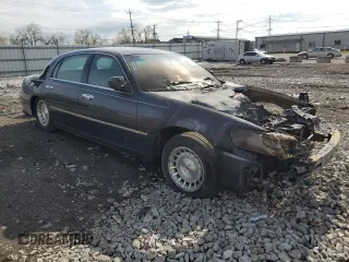 1999 Lincoln Town Car Executive z VIN 1LNHM81W0XY644873, wystawiony jako Copart lot #52865095 z przebiegiem Nie podano mil oraz Szkoda całkowita • Salvage title. Historia ofert i sprzedaży dostępna na DreamBid. Obrazek 4.