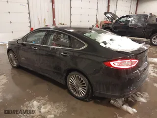 2014 Ford Fusion Titanium Hybrid with VIN 3FA6P0RUXER355654, listed as a IAAI auction lot 41611653 with 211,353 mi miles. Bid and sale history available at carsss.com. Image 3.