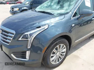 2019 Cadillac XT5 Luxury FWD z VIN 1GYKNCRS1KZ259282, wystawiony jako IAAI lot #41921030 z przebiegiem 27 880 mil mil oraz . Historia ofert i sprzedaży dostępna na DreamBid. Obrazek 17.