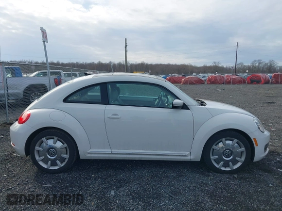 2014 Volkswagen Beetle 2.5L w/Sun with VIN 3VWJP7AT8EM611560, listed as a IAAI auction lot 41488488 with 140,798 mi miles and . Bid and sale history available at DreamBid. Image 14.