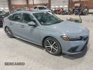 2023 Honda Civic Touring z VIN 2HGFE1F95PH317044, wystawiony jako IAAI lot #41952065 z przebiegiem 61 663 mil mil oraz . Historia ofert i sprzedaży dostępna na DreamBid. Obrazek 1.