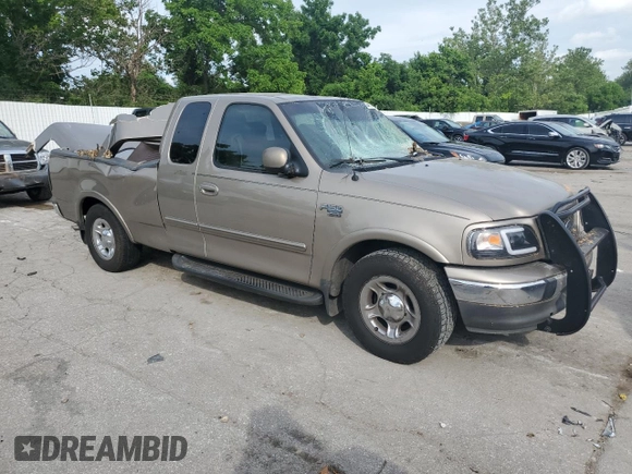 2002 Ford F-150 XL with VIN 1FTRX17L02KC02580, listed as a Copart auction lot 60859595 with 175,892 mi miles and Salvage title. Bid and sale history available at DreamBid. Image 4.
