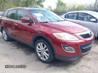 2011 Mazda CX-9 Grand Touring z VIN JM3TB2DA6B0310296, wystawiony jako IAAI lot #42022744 z przebiegiem 163 889 mil mil oraz . Historia ofert i sprzedaży dostępna na DreamBid. Obrazek 1.