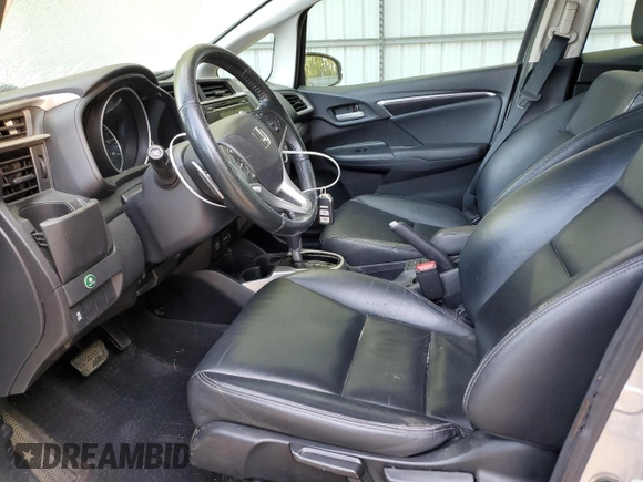 2015 Honda Fit EX-L z VIN 3HGGK5H82FM778601, wystawiony jako Copart lot #52494015 z przebiegiem 143 890 mil mil oraz Szkoda całkowita • Salvage title. Historia ofert i sprzedaży dostępna na DreamBid. Obrazek 7.