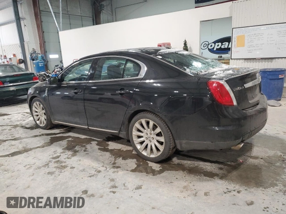2012 Lincoln MKS z VIN 1LNHL9ER5CG806929, wystawiony jako Copart lot #85328514 z przebiegiem 155 015 mil mil oraz Szkoda całkowita • Salvage title. Historia ofert i sprzedaży dostępna na DreamBid. Obrazek 2.