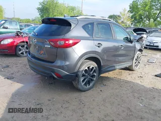 2016 Mazda CX-5 Grand Touring with VIN JM3KE4DYXG0724183, listed as a IAAI auction lot 42176009 with 152,695 mi miles and . Bid and sale history available at DreamBid. Image 4.