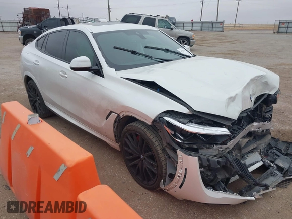 2021 BMW X6 M50i z VIN 5UXCY8C01M9E51506, wystawiony jako IAAI lot #41538726 z przebiegiem Nie podano mil oraz . Historia ofert i sprzedaży dostępna na DreamBid. Obrazek 1.