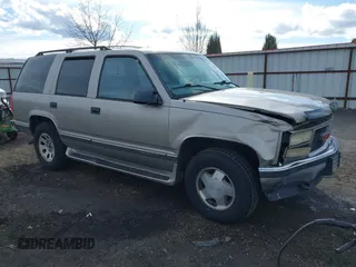 1999 GMC Yukon with VIN 1GKEK13R2XJ712390, listed as a IAAI auction lot 41793649 with 222,721 mi miles. Bid and sale history available at carsss.com. Image 1.