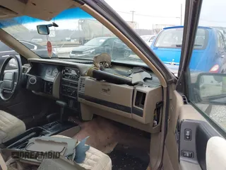 1995 Jeep Grand Cherokee Laredo with VIN 1J4GZ58S4SC555309, listed as a IAAI auction lot 41600141 with 130,493 mi miles. Bid and sale history available at carsss.com. Image 5.