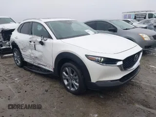 2022 Mazda CX-30 S Premium with VIN 3MVDMBDL1NM452807, listed as a IAAI auction lot 41035064 with 20,082 mi miles and . Bid and sale history available at carsss.com. Image 1.