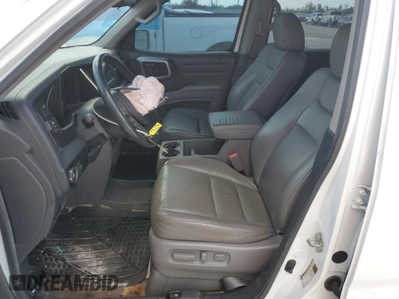 2010 Honda Ridgeline RTL with VIN 5FPYK1F51AB011041, listed as a Copart auction lot 77210844 with 81,265 mi miles and Salvage Title. Bid and sale history available at carsss.com. Image 7.