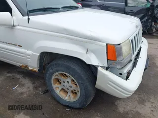 1997 Jeep Grand Cherokee Limited z VIN 1J4GZ78S1VC536295, wystawiony jako IAAI lot #42435292 z przebiegiem 310 005 mil mil oraz . Historia ofert i sprzedaży dostępna na DreamBid. Obrazek 12.