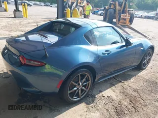 2018 Mazda MX-5 Miata Grand Touring with VIN JM1NDAM71J0201351, listed as a IAAI auction lot 42401474 with 96,054 mi miles and . Bid and sale history available at DreamBid. Image 4.