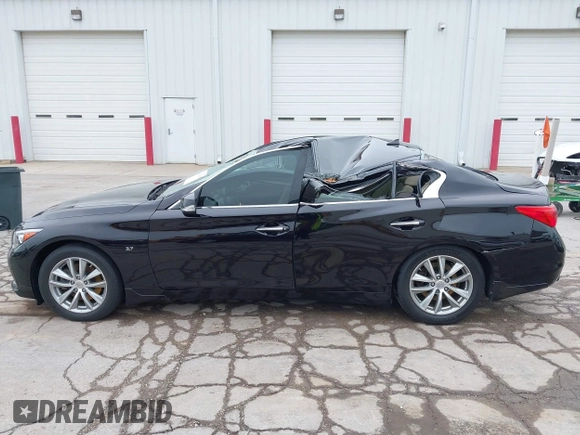 2015 Infiniti Q50 Premium with VIN JN1BV7AR8FM396828, listed as a IAAI auction lot 42313019 with 130,707 mi miles and . Bid and sale history available at DreamBid. Image 13.
