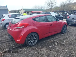 2012 Hyundai Veloster w/Black Int z VIN KMHTC6AD4CU072868, wystawiony jako IAAI lot #42029030 z przebiegiem 112 817 mil mil oraz . Historia ofert i sprzedaży dostępna na DreamBid. Obrazek 4.