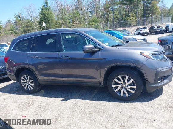 2021 Honda Pilot EX-L with VIN 5FNYF6H59MB016354, listed as a IAAI auction lot 42108020 with 61,436 mi miles and . Bid and sale history available at DreamBid. Image 14.